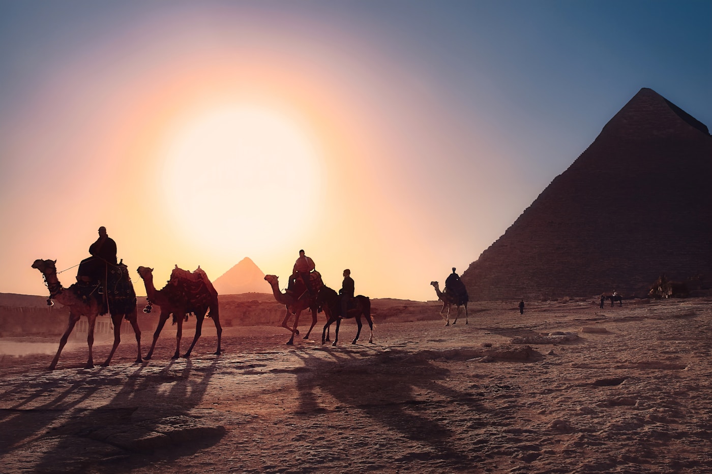 Camel riders at the Pyramids of Giza