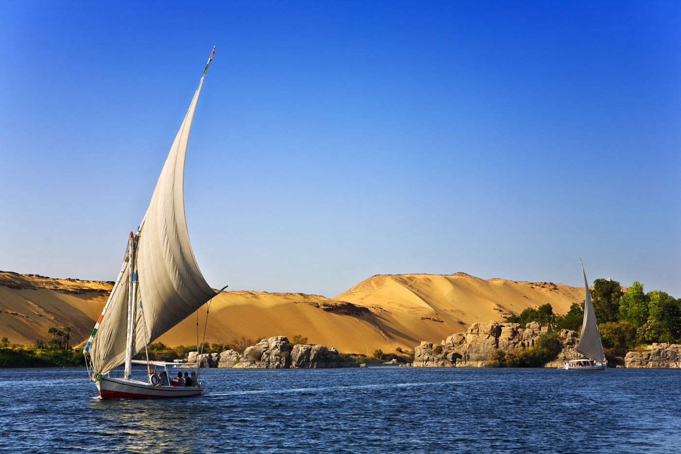White sailboat felucca on the Nile